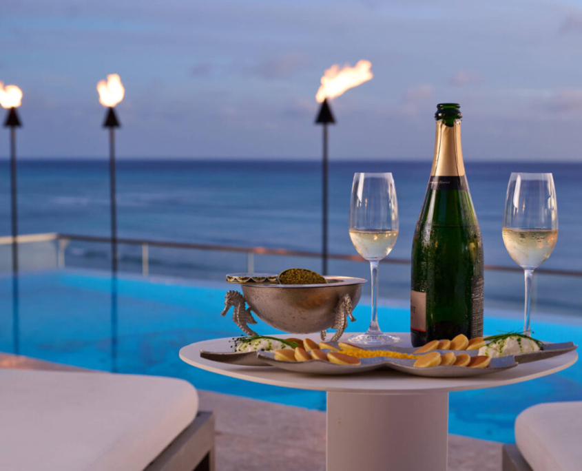 Champagne and caviar service next to the rooftop infinity pool at ESPACIO.