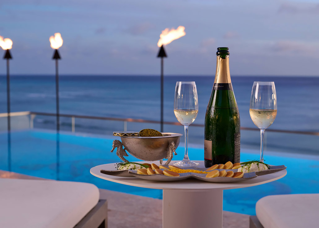 Champagne and caviar service next to the rooftop infinity pool at ESPACIO.
