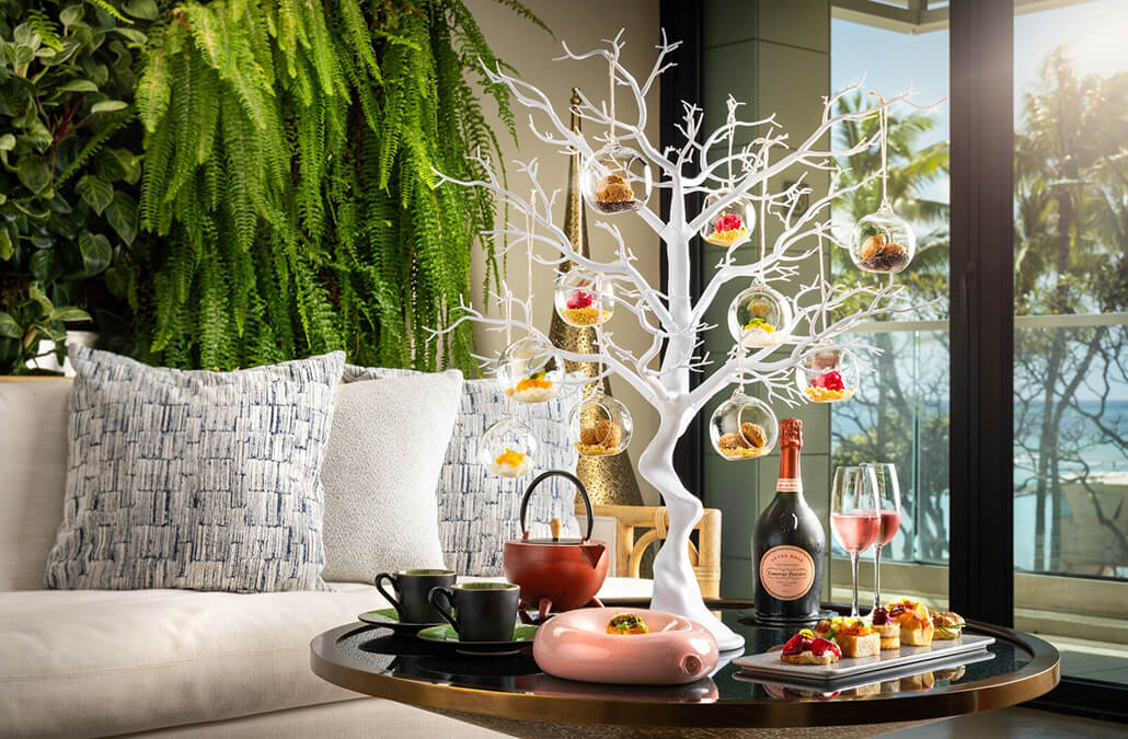 Champagne, tea kettles, and ornaments with hors d'oeuvres.